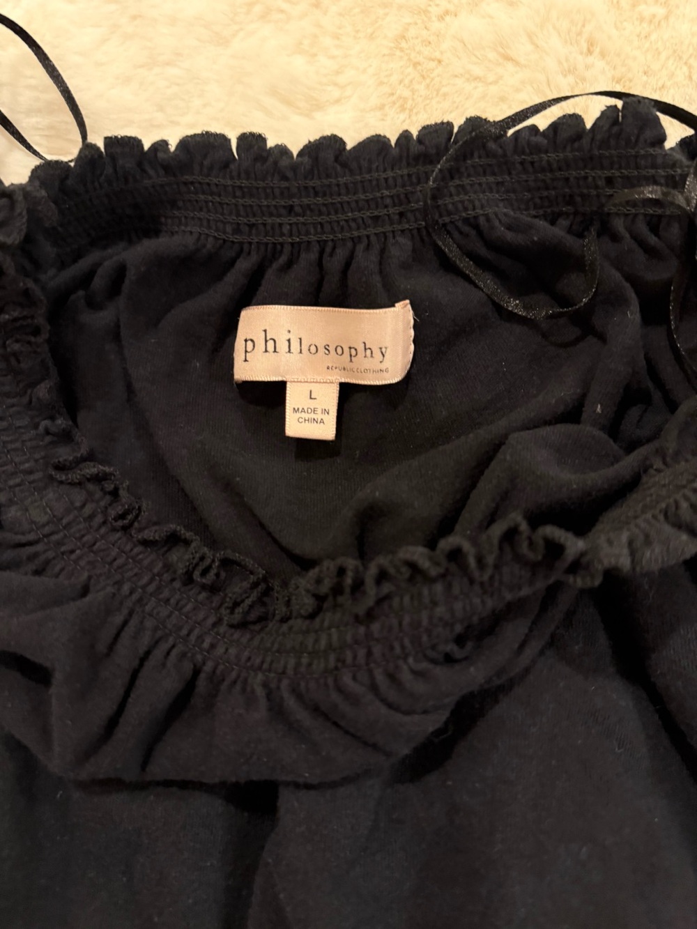 Philosophy top- preloved washed and dried. Smoke and pet free home